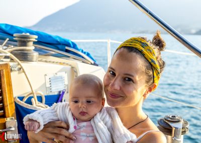Baby and lady sailing in Lefkada, Greece