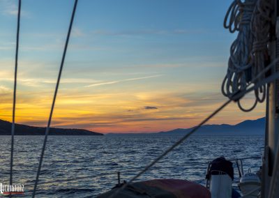 Sailboat sailing at sunset