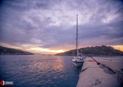 Boat on dock during sunrise
